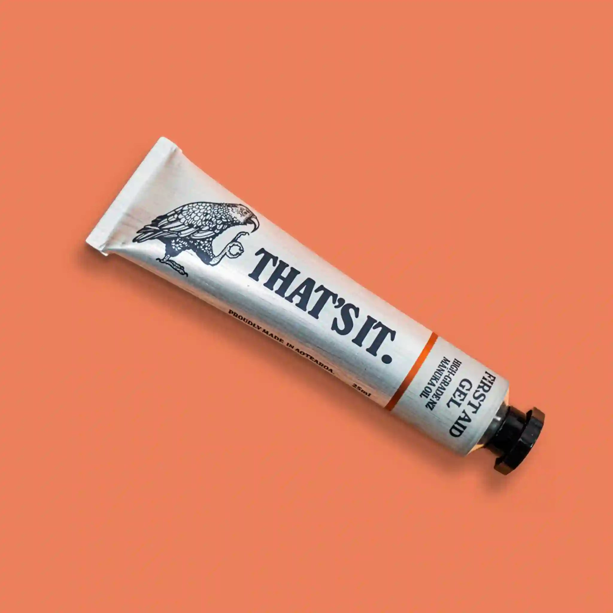 Tube of 'THAT'S IT.' product on a peach background