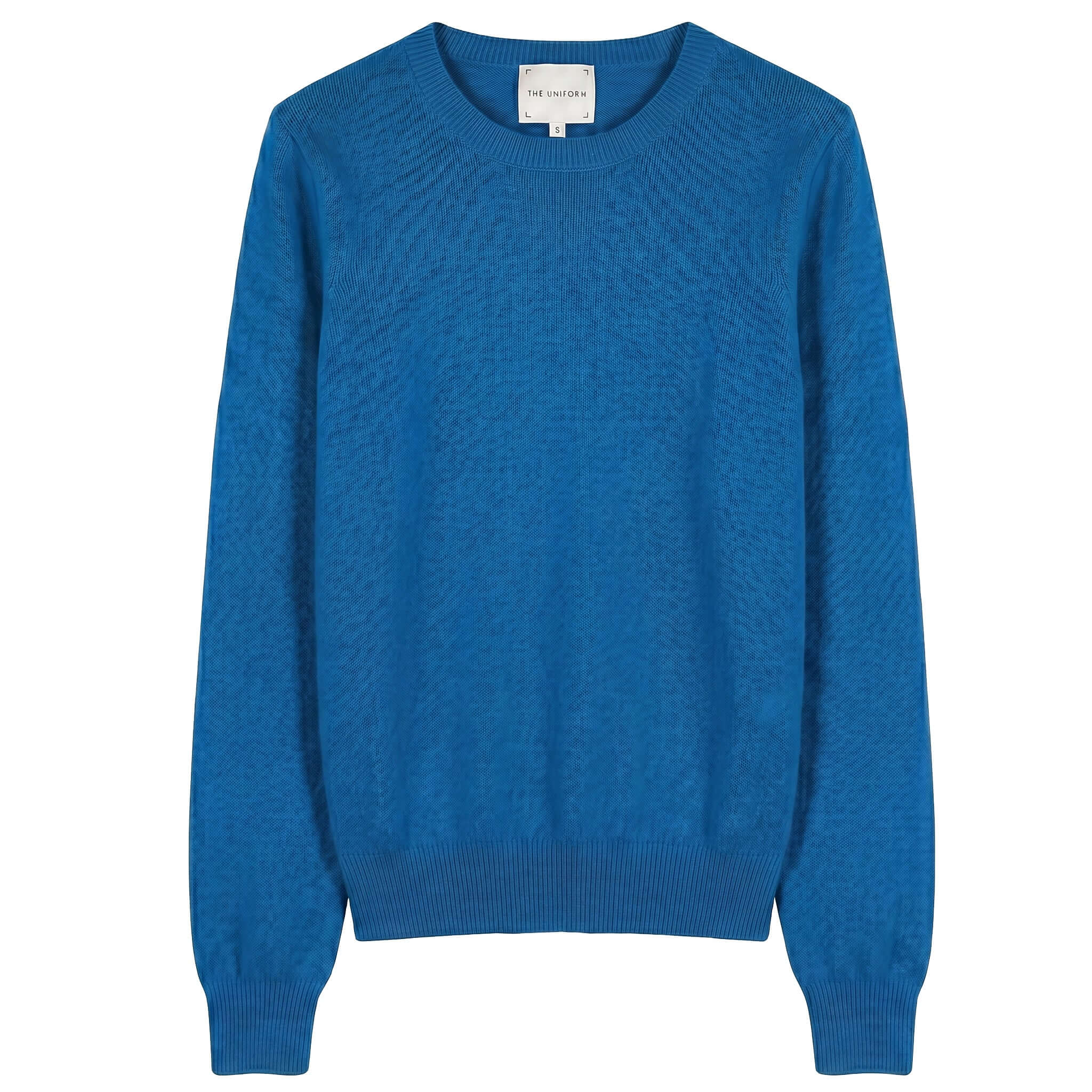 The Uniform Cashmere Crew Neck Sweater - Sapphire displayed in a vibrant blue color, featuring a relaxed fit and ribbed details.