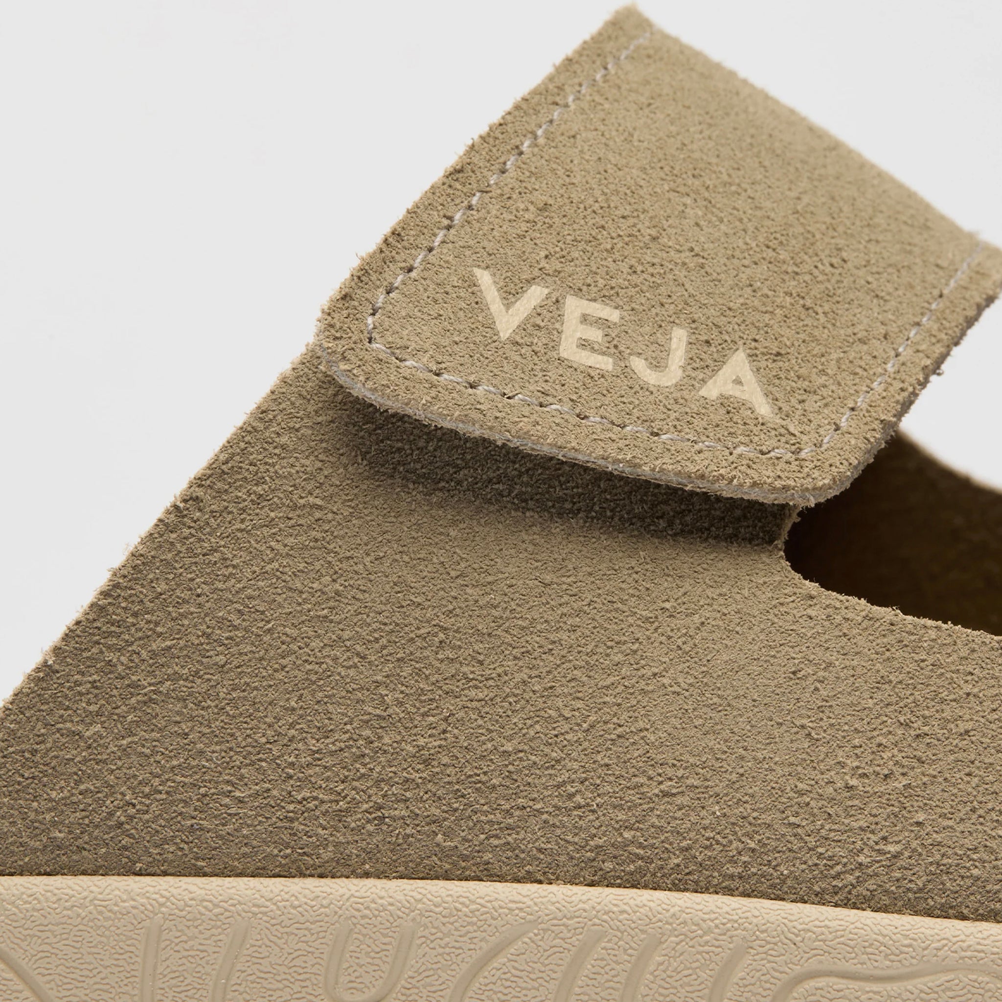 Close-up of a Veja shoe with a focus on the brand logo.
