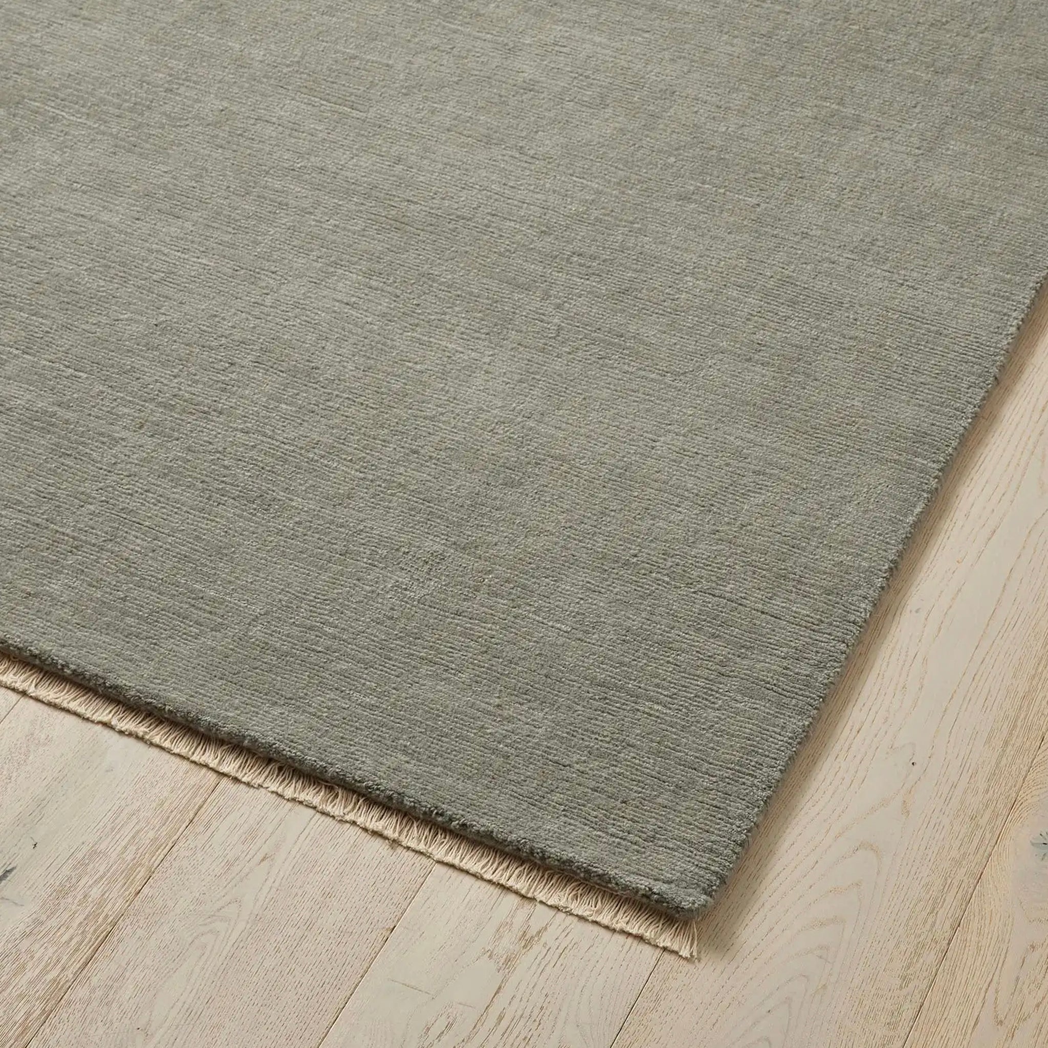 Gray rug on a wooden floor