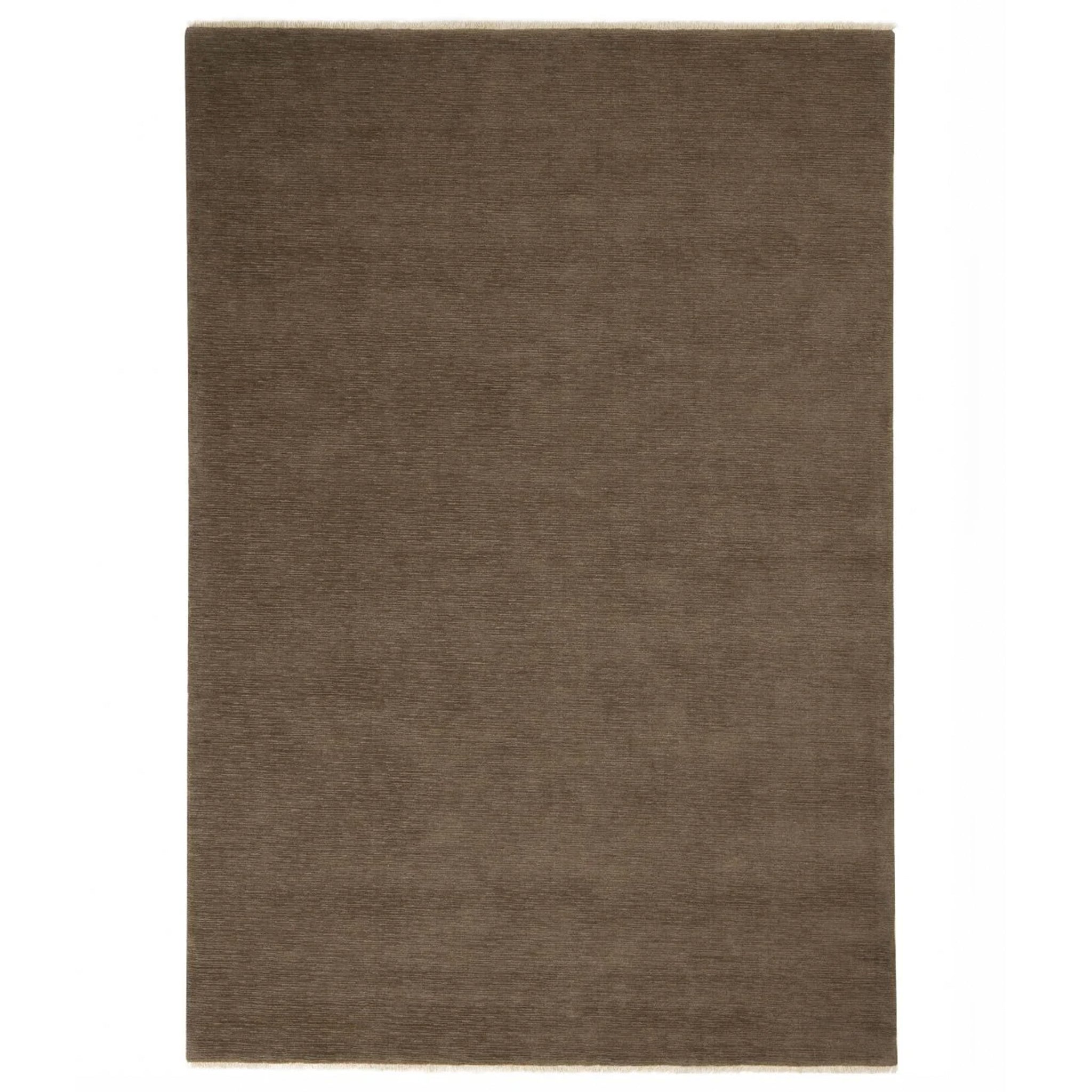 Brown rectangular rug on a white background