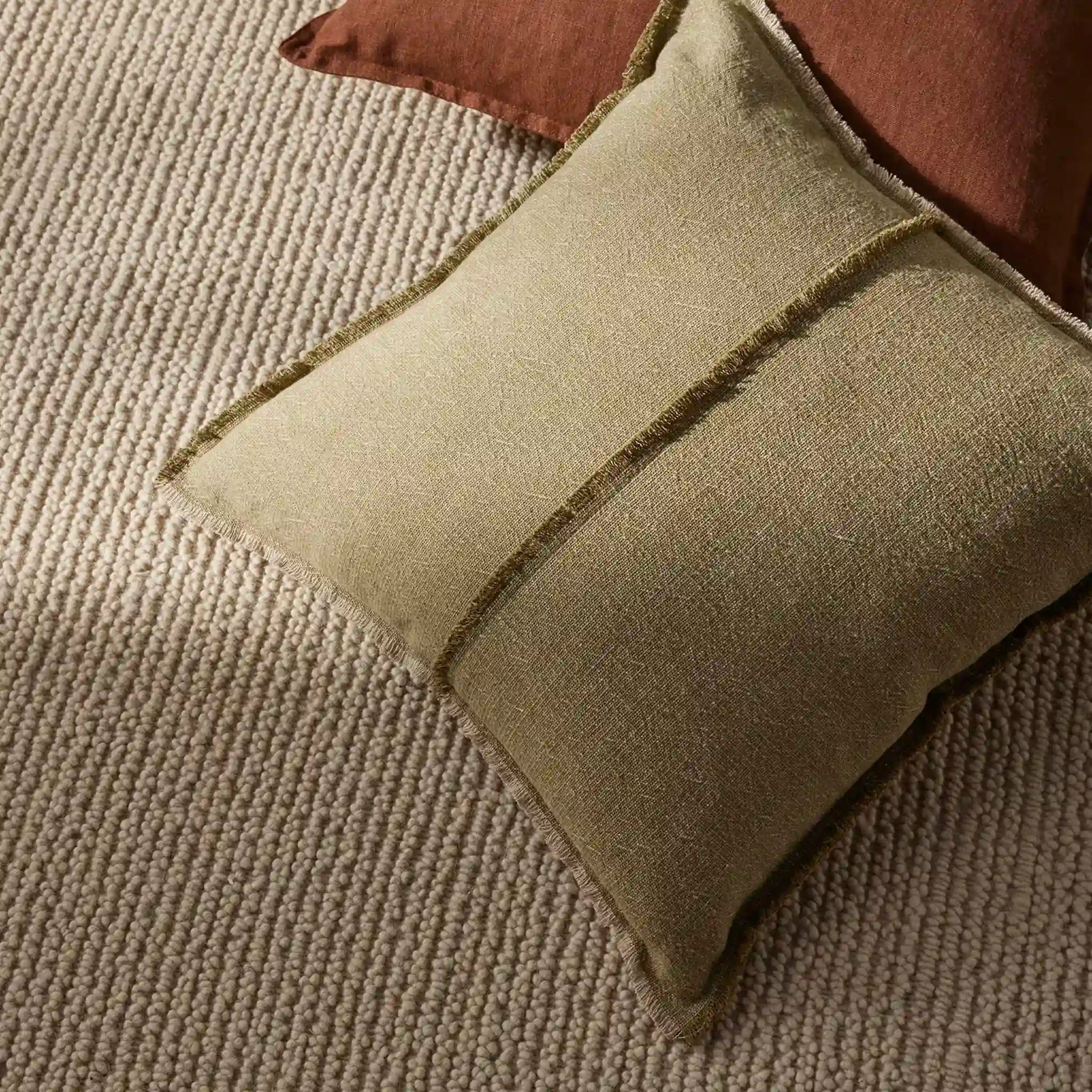 Green cushion on a textured surface