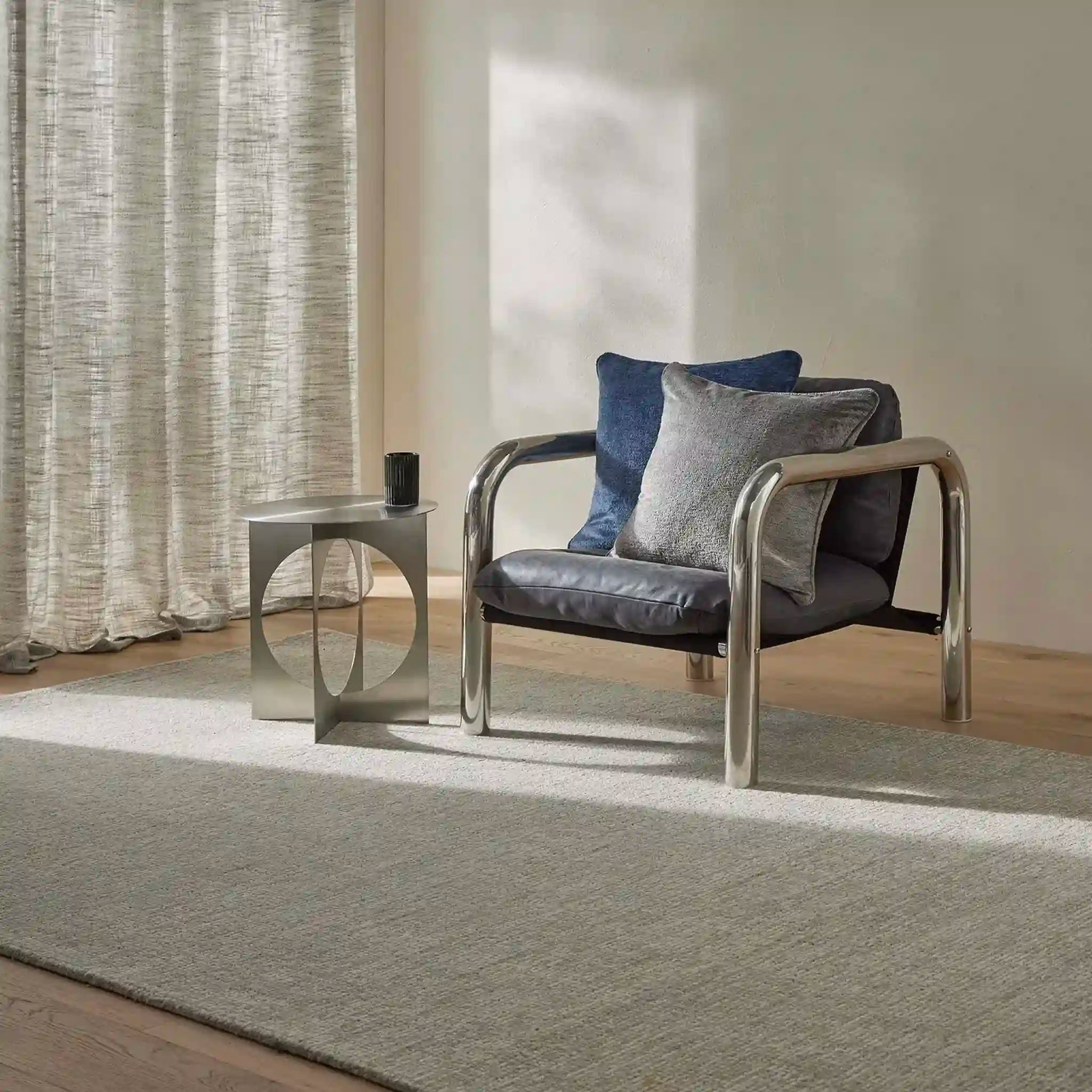 Modern armchair with cushions in a living room setting