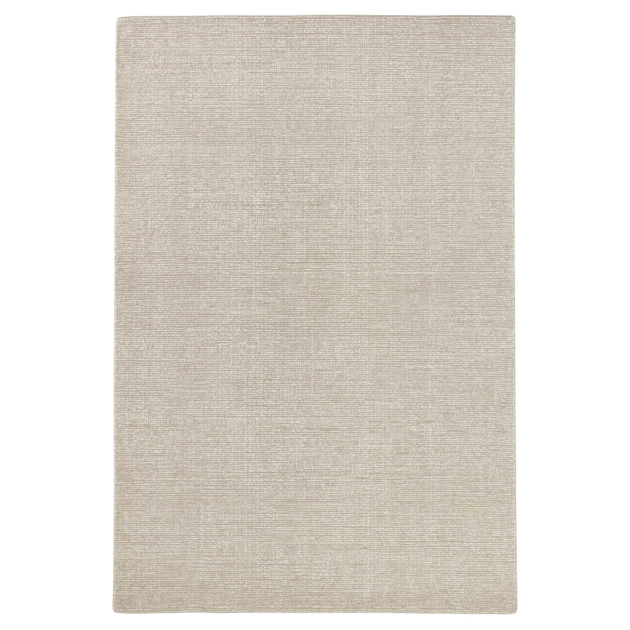 Beige area rug on a white background