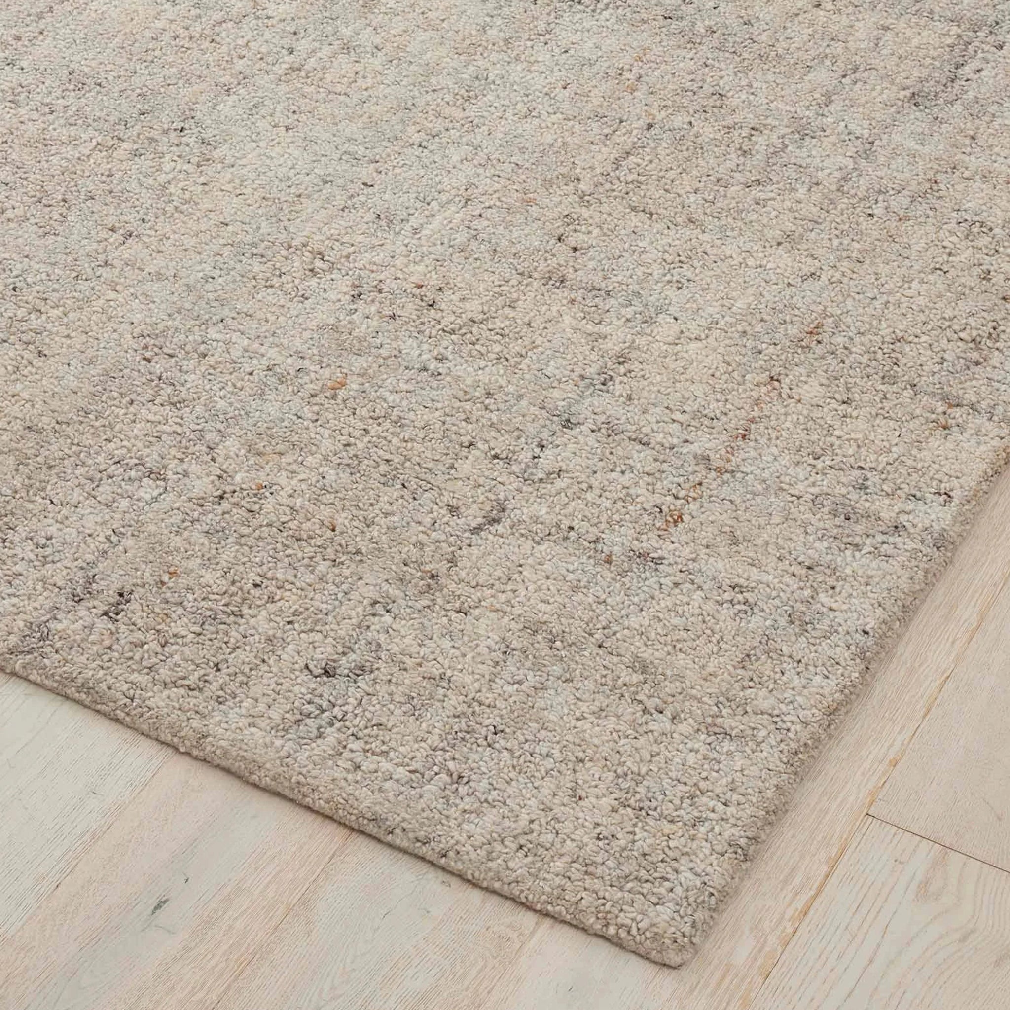 Beige carpet on a wooden floor