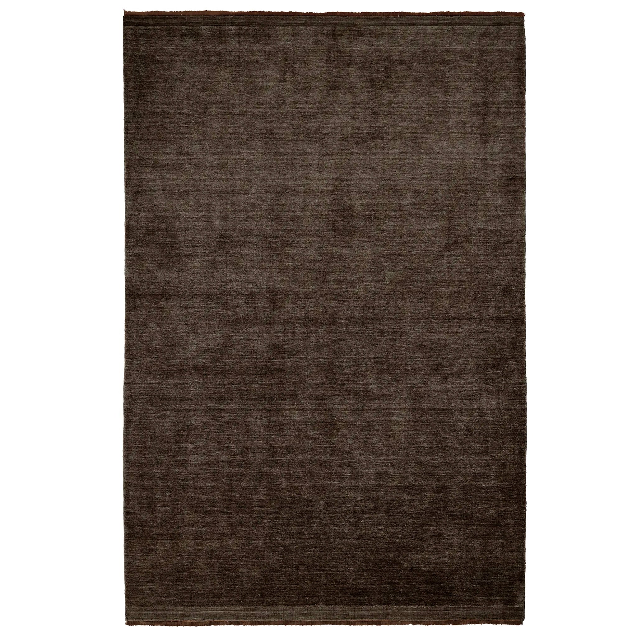 Dark brown rug on a white background