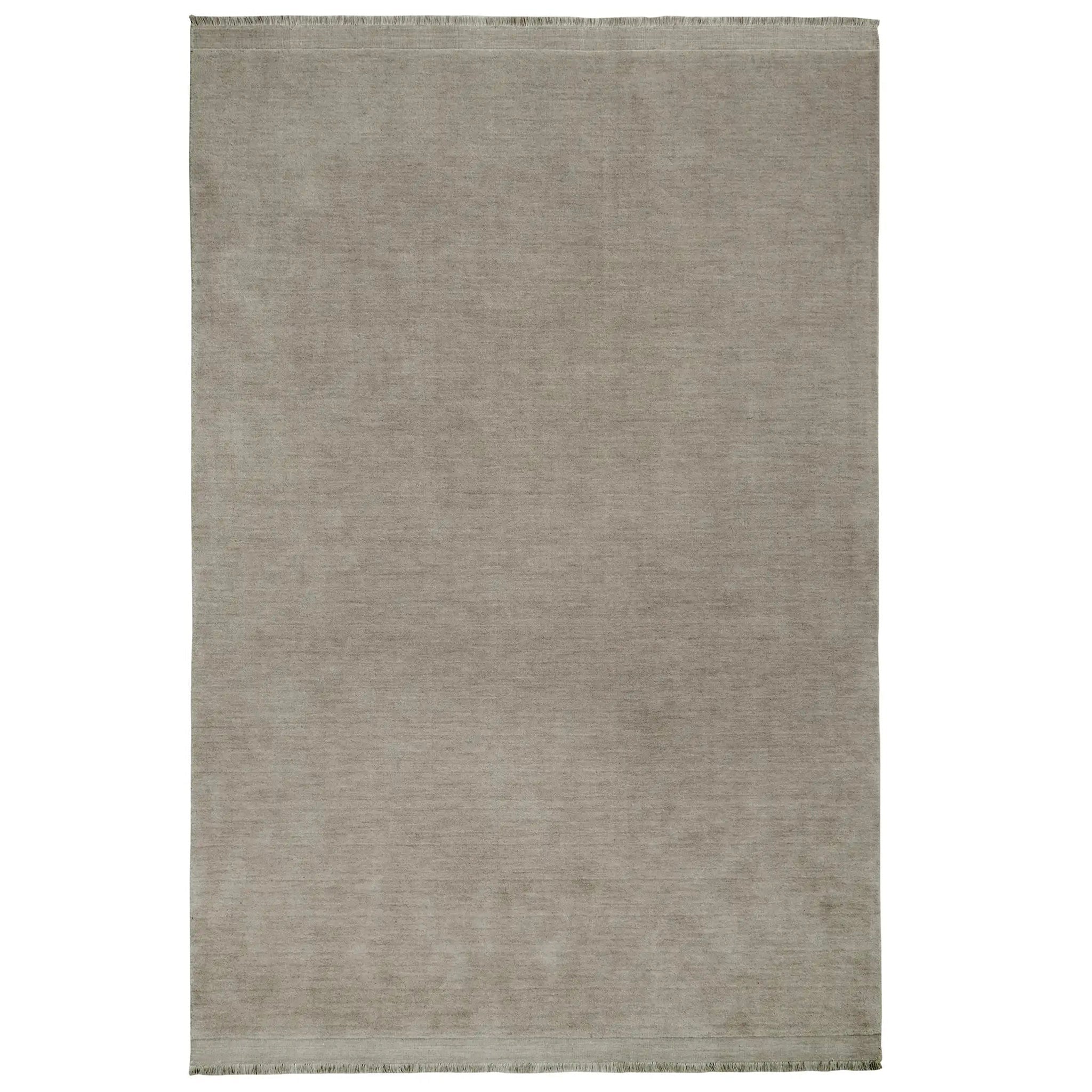 A contemporary rug in a grey color, featuring a textured design and a fringe edge
