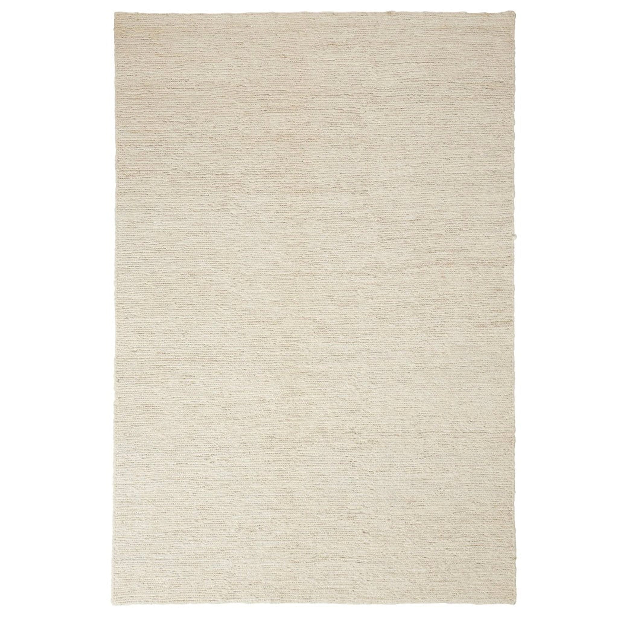 Beige area rug on a white background