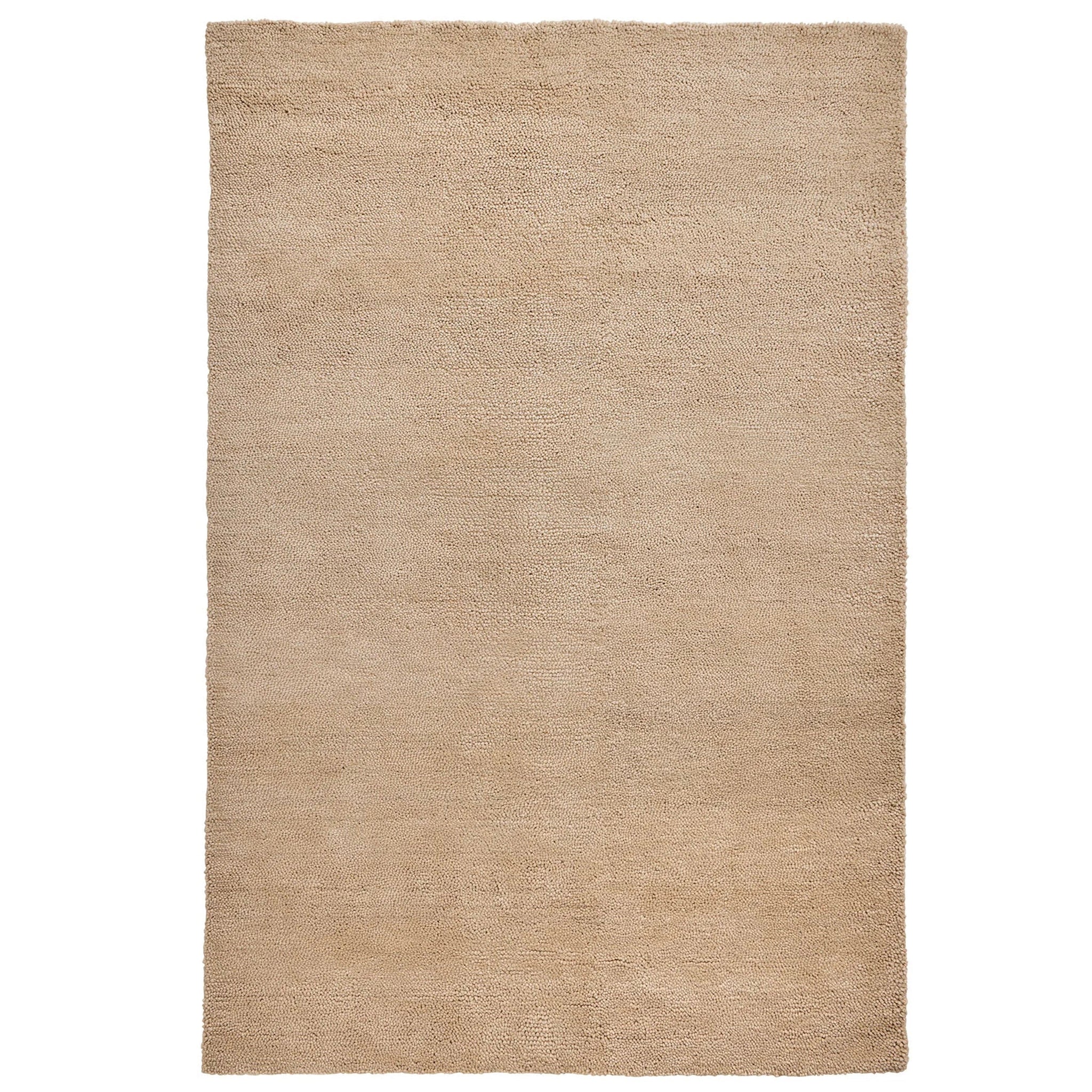Beige area rug on a white background
