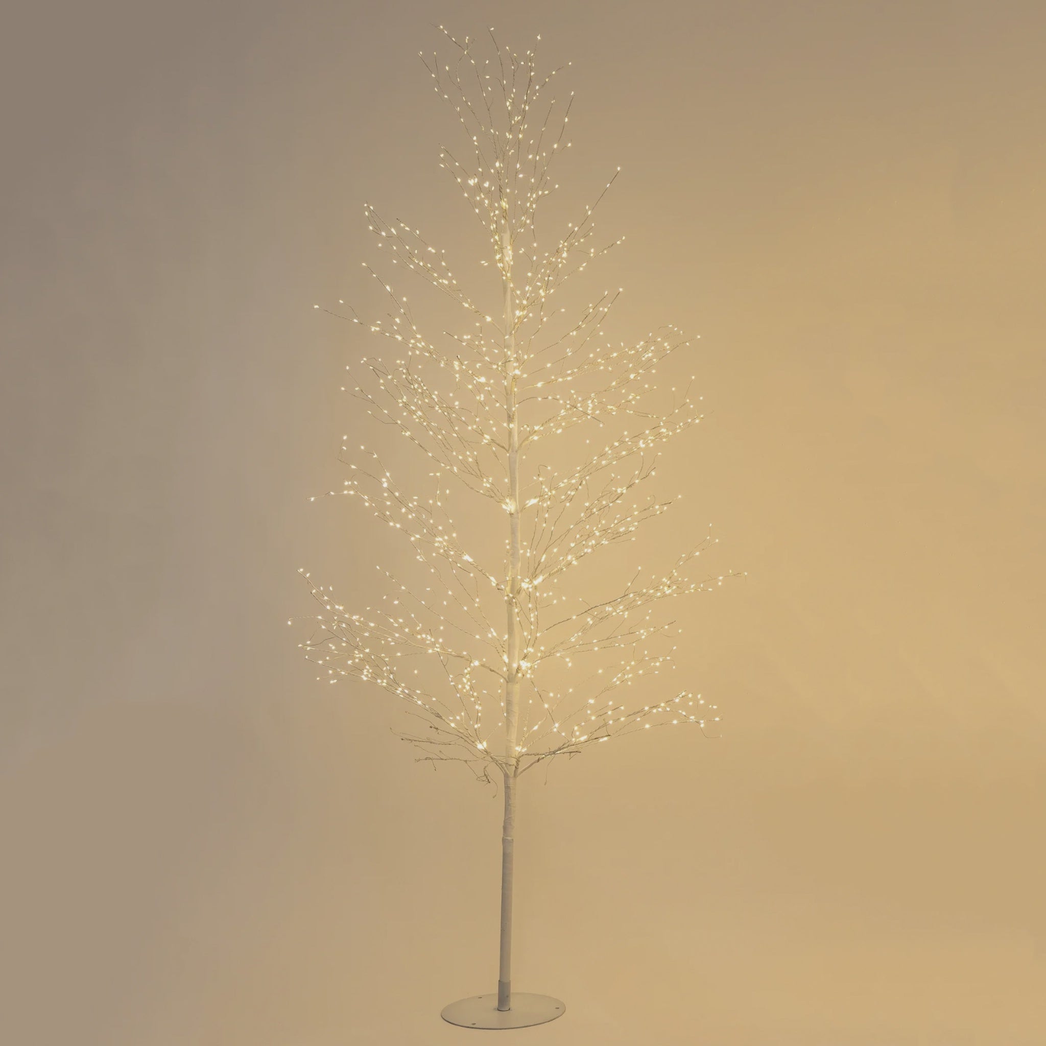 Decorative LED tree with lights on a plain background