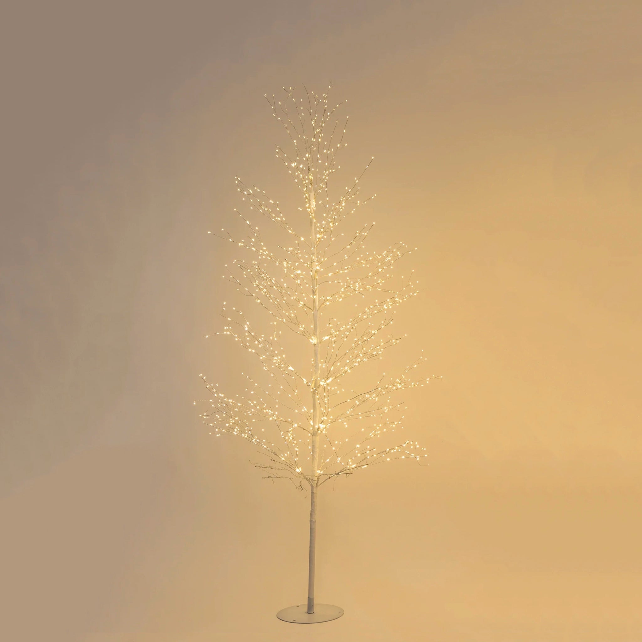 Decorative tree with lights on a plain background