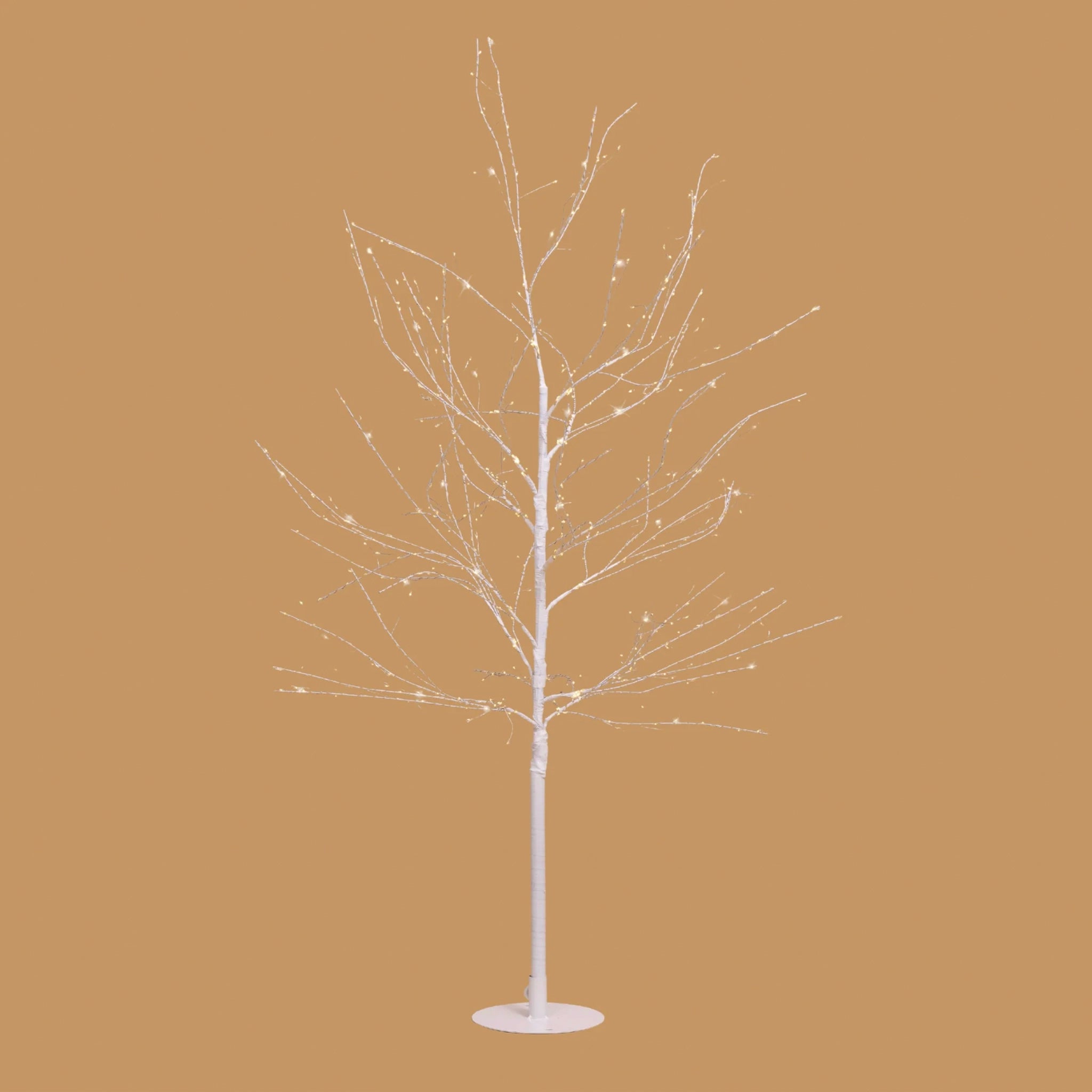 Decorative white LED tree on a beige background