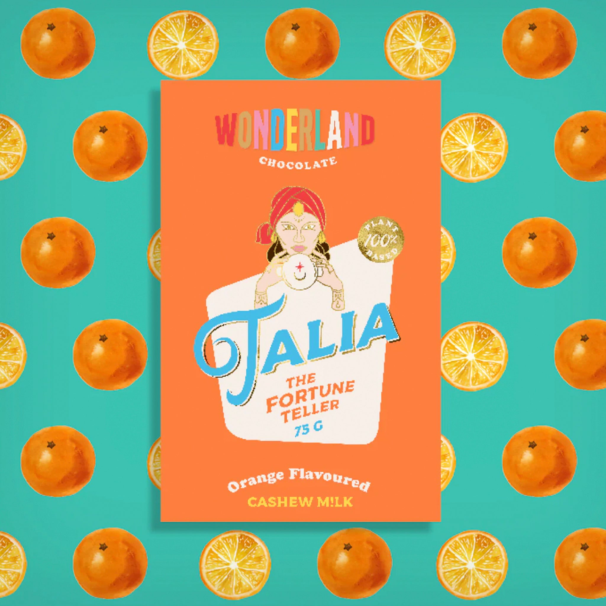 Chocolate bar packaging with 'Wonderland Chocolate' and 'Talia the Fortune Teller' on an orange and turquoise background with oranges and lemon slices.