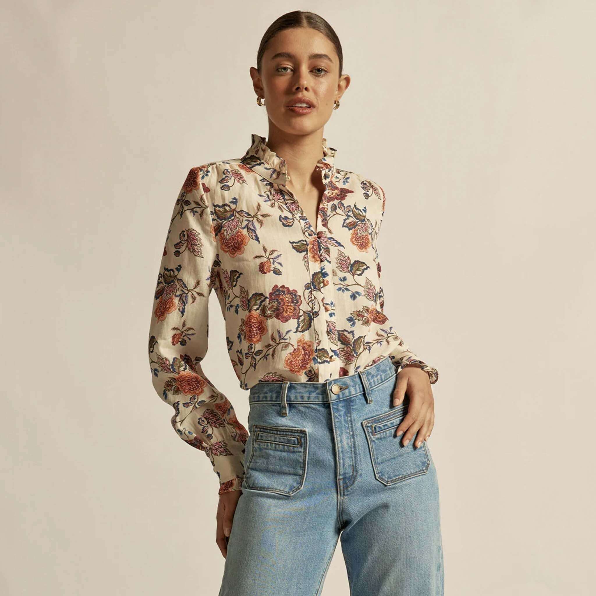 Alt Tag: Zoe Kratzmann Stir Top - Heirloom Bloom floral ramie blouse with ruffle trim, long sleeves, worn with high-waist jeans