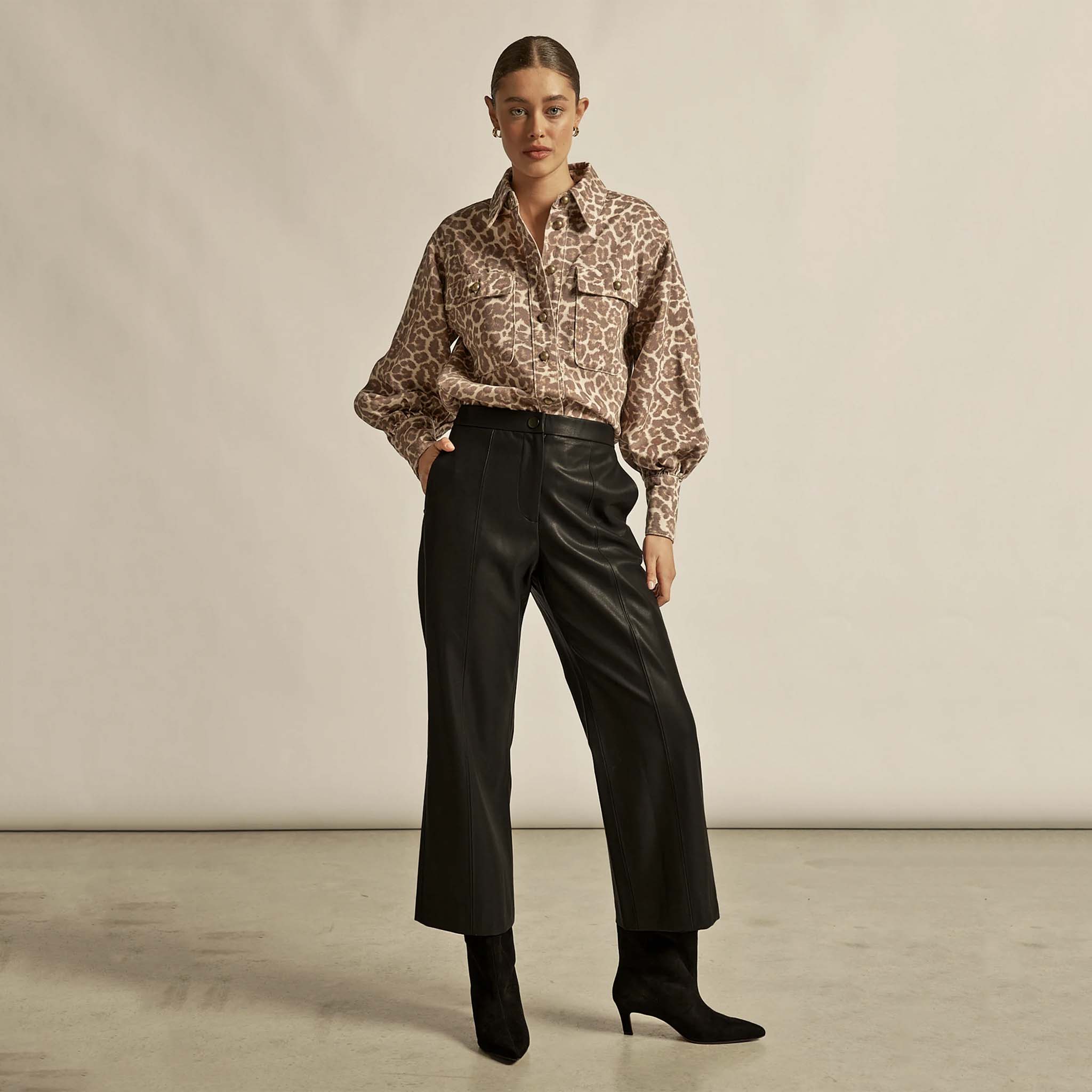 Alt Tag: Zoe Kratzmann Crest Top - Ocelot ocelot print shirt styled with black wide-leg leather pants and black ankle boots