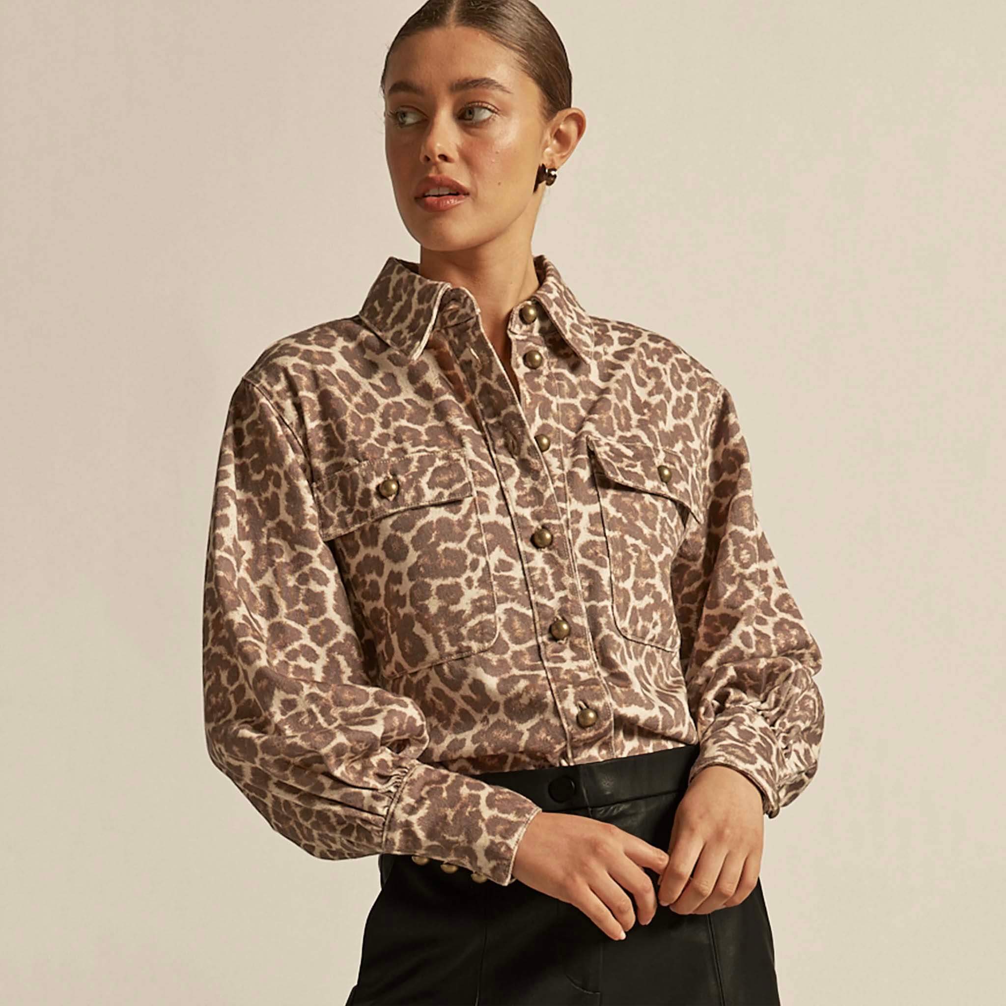 Alt Tag: Zoe Kratzmann Crest Top - Ocelot ocelot print denim-style shirt on model, long sleeves, button front, chest pockets