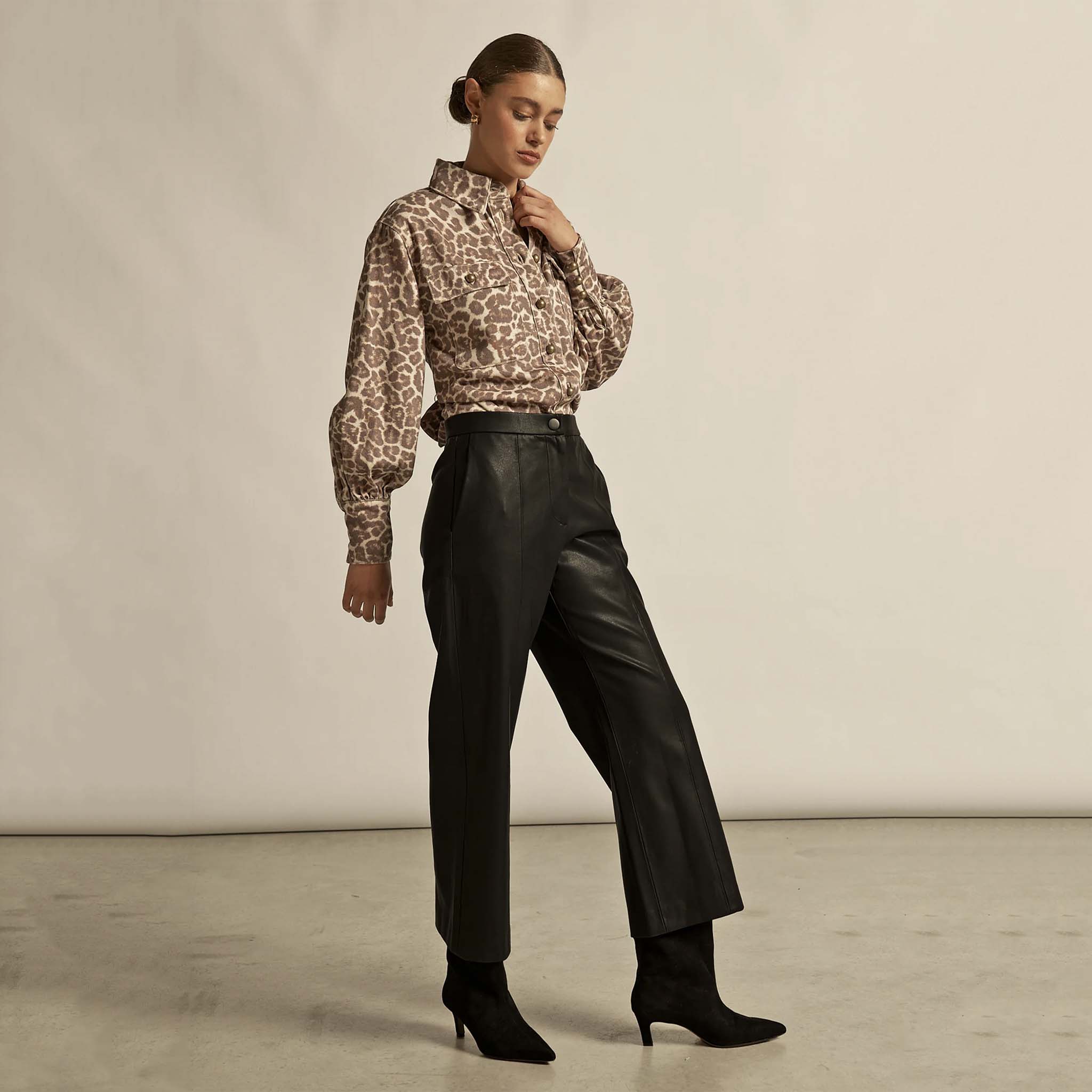 Alt Tag: Zoe Kratzmann Crest Top - Ocelot ocelot print button-up shirt styled with high-waisted black leather pants and black ankle boots