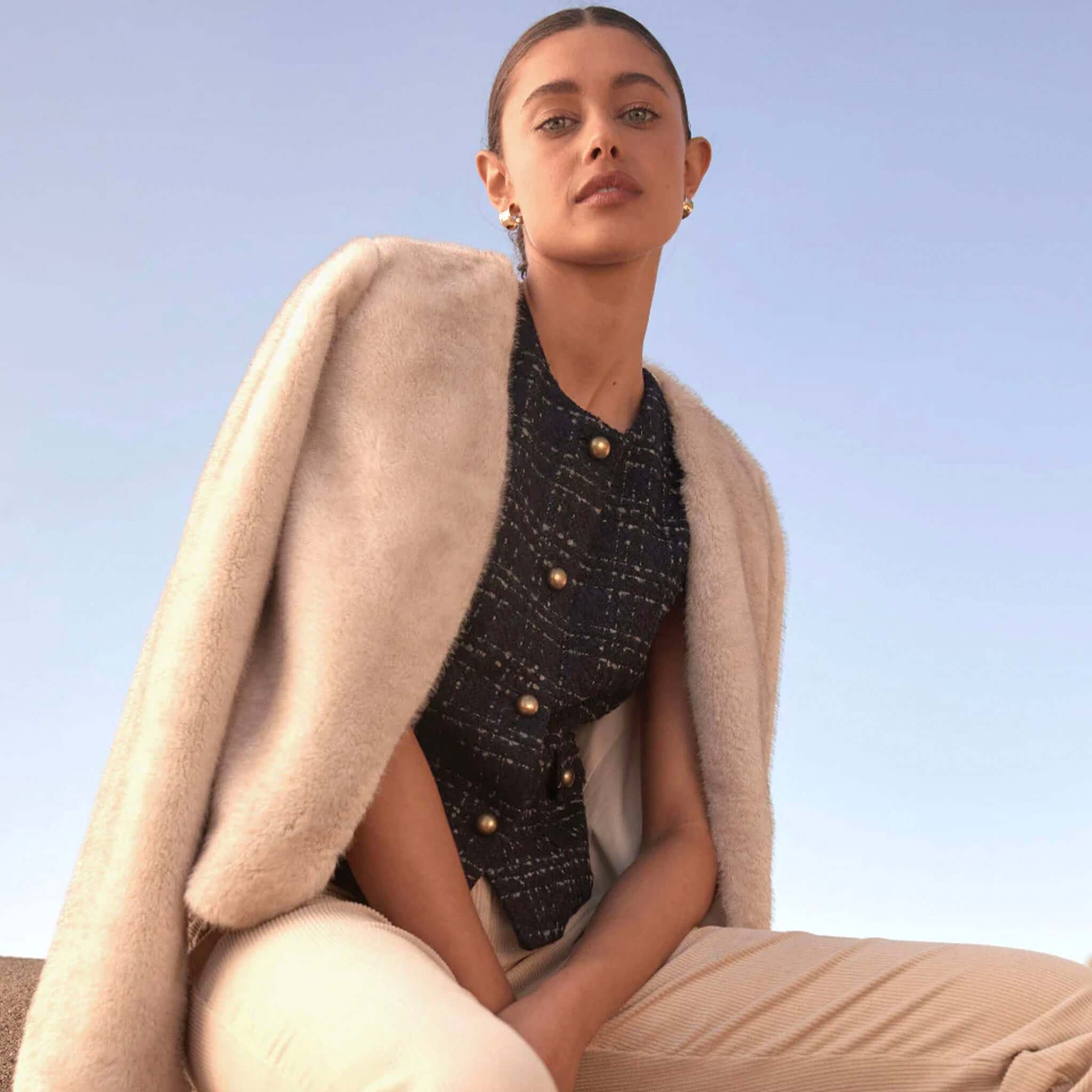 Alt Tag: Zoe Kratzmann Dune Jacket - Ecru faux fur jacket draped on model, soft-touch winter layer with chic V-neckline