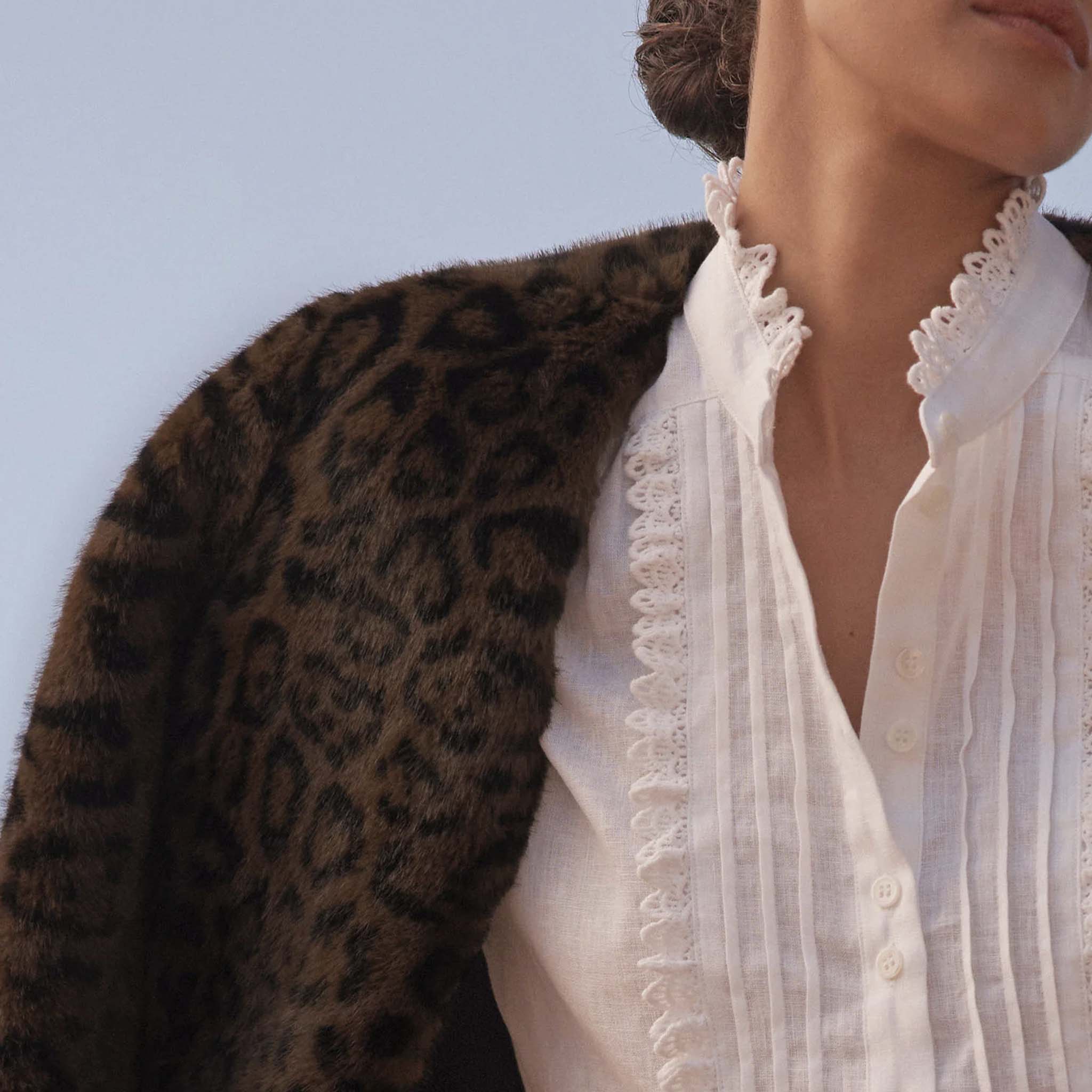 Zoe Kratzmann Dune Jacket - Ocelot plush faux fur cropped jacket in ocelot print layered over white lace blouse