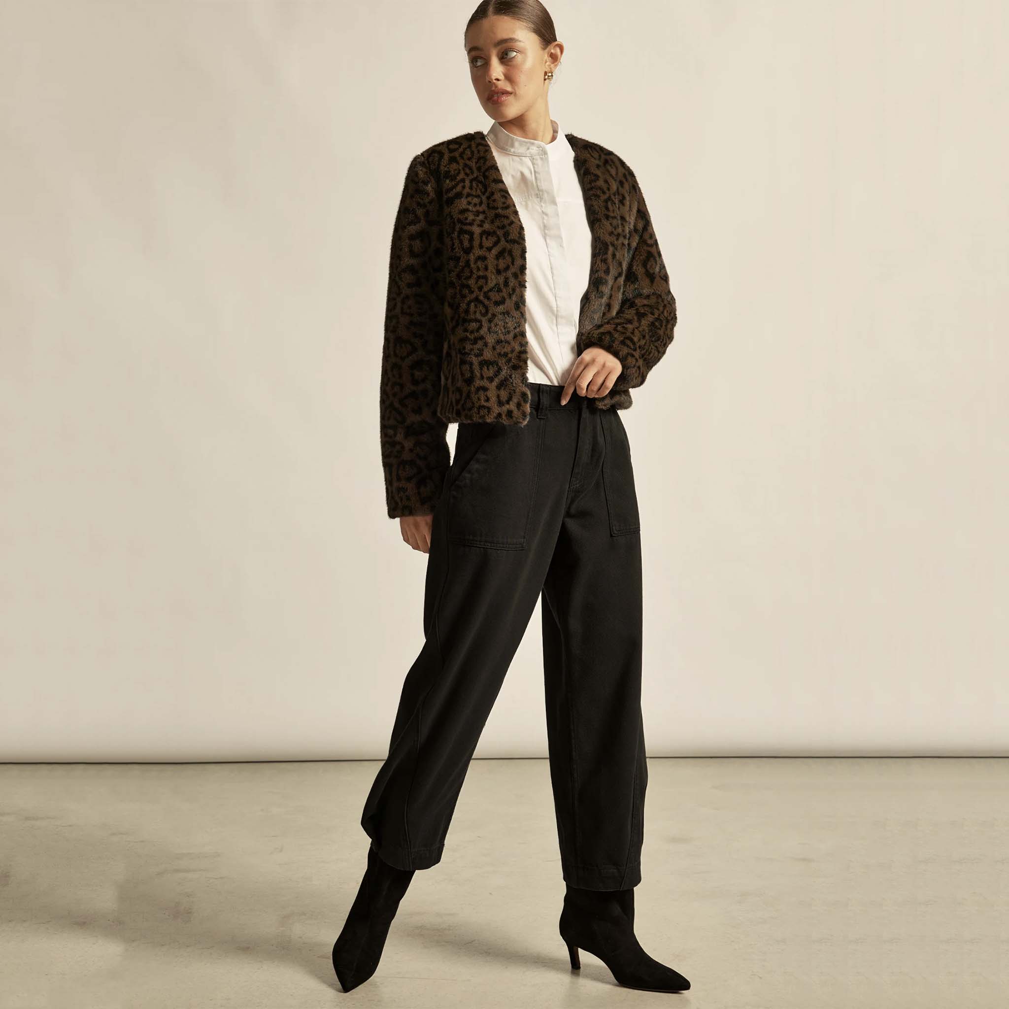 Alt Tag: Zoe Kratzmann Dune Jacket - Ocelot plush faux fur cropped V-neck jacket styled with black pants and boots