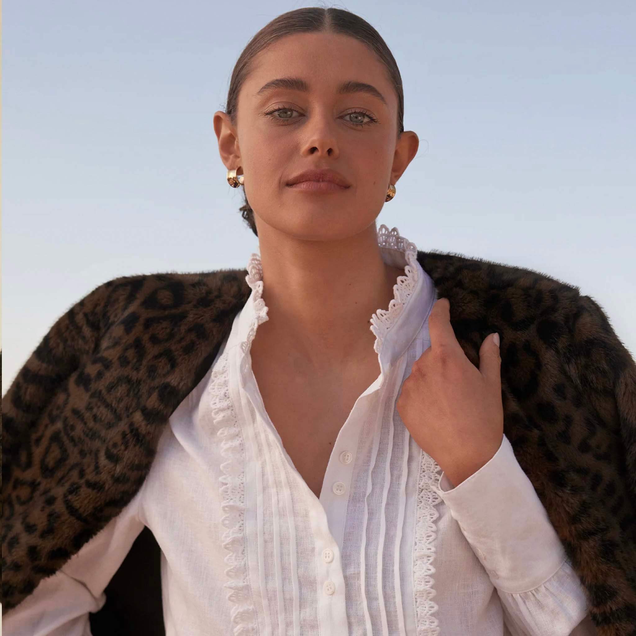 Zoe Kratzmann Dune Jacket - Ocelot faux fur jacket draped over model, plush leopard print winter layer