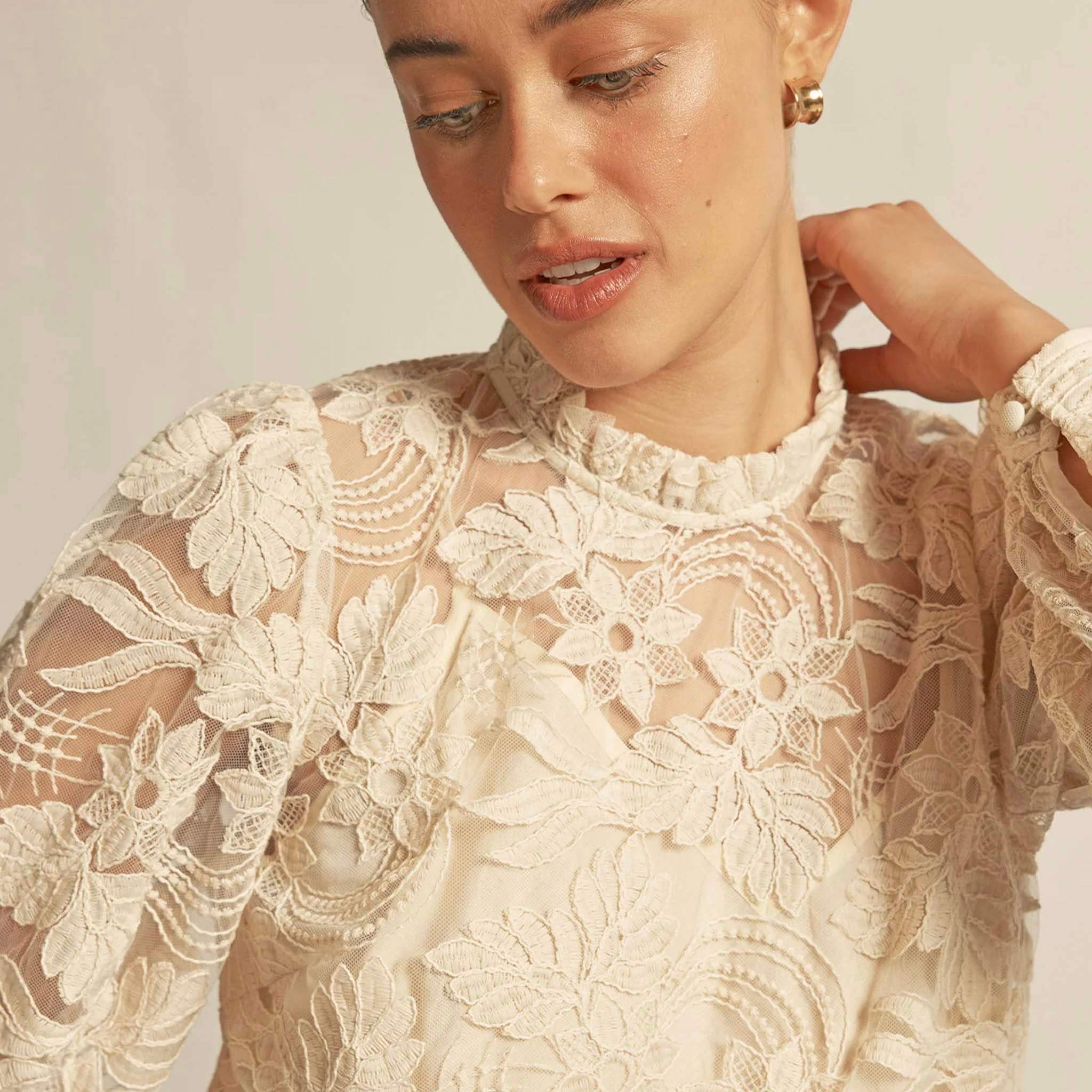 Zoe Kratzmann Glint Top - Ecru intricate lace blouse with floral detail, frill neckline and long sleeves, close-up