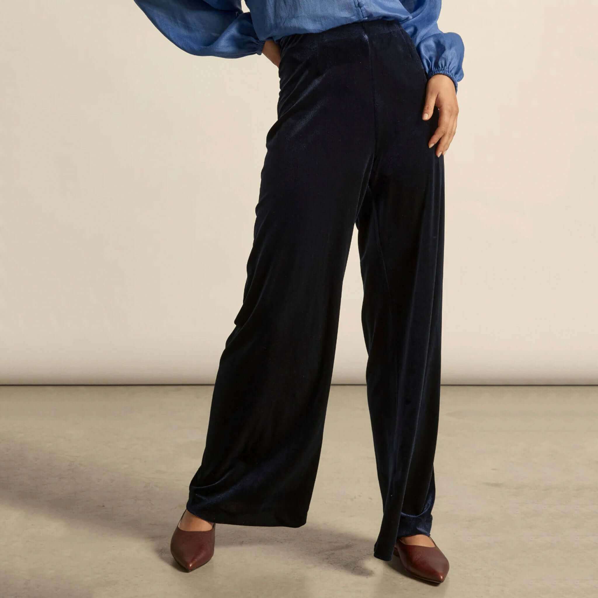 Alt Tag: Zoe Kratzmann Haven Pants - Midnight velvet-feel wide-leg pants with soft waistband and invisible rear zip, styled with blouse