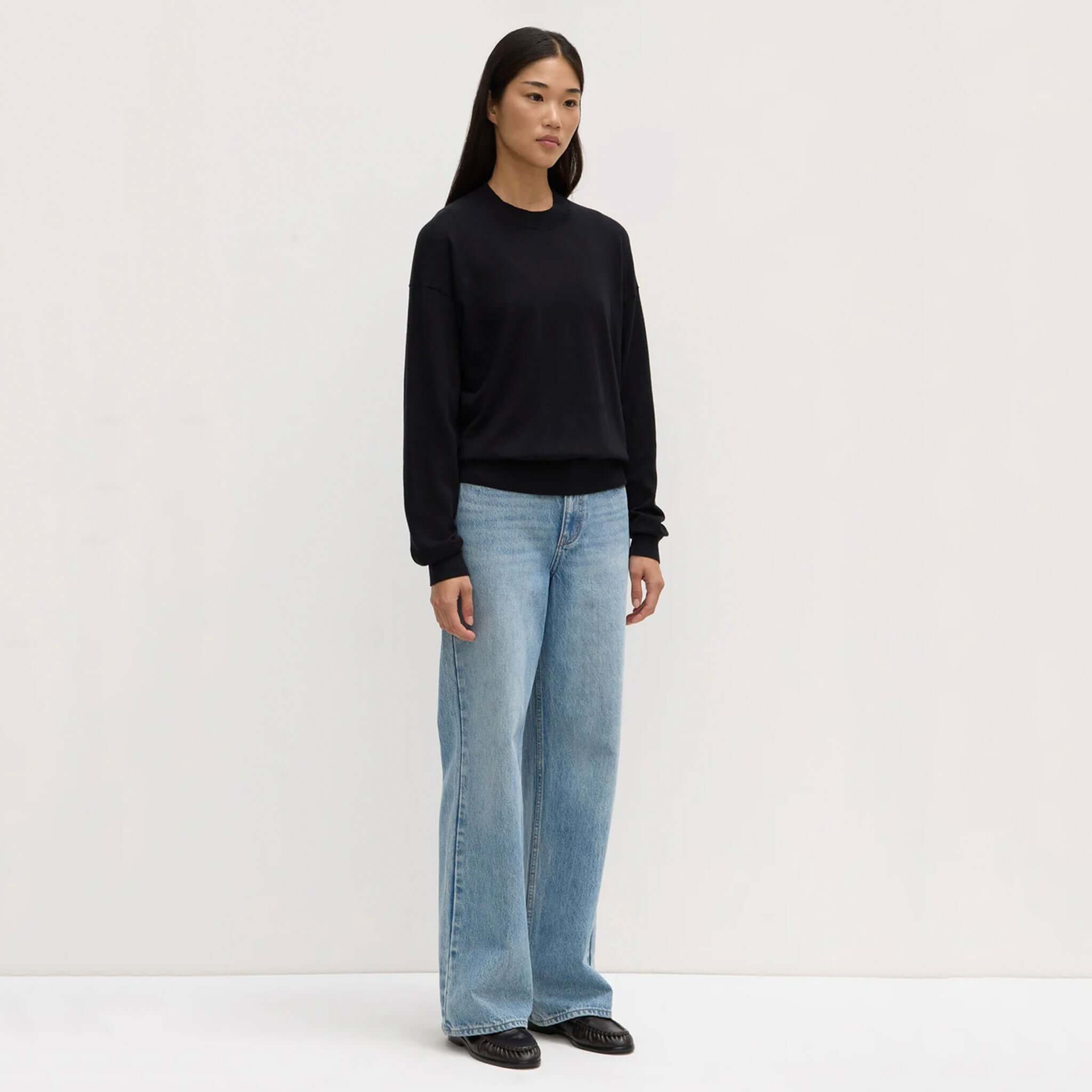 Alt Tag: Assembly Label Cotton Cashmere Lounge Sweater - Black on model, ribbed neck and cuffs, premium cotton cashmere knit