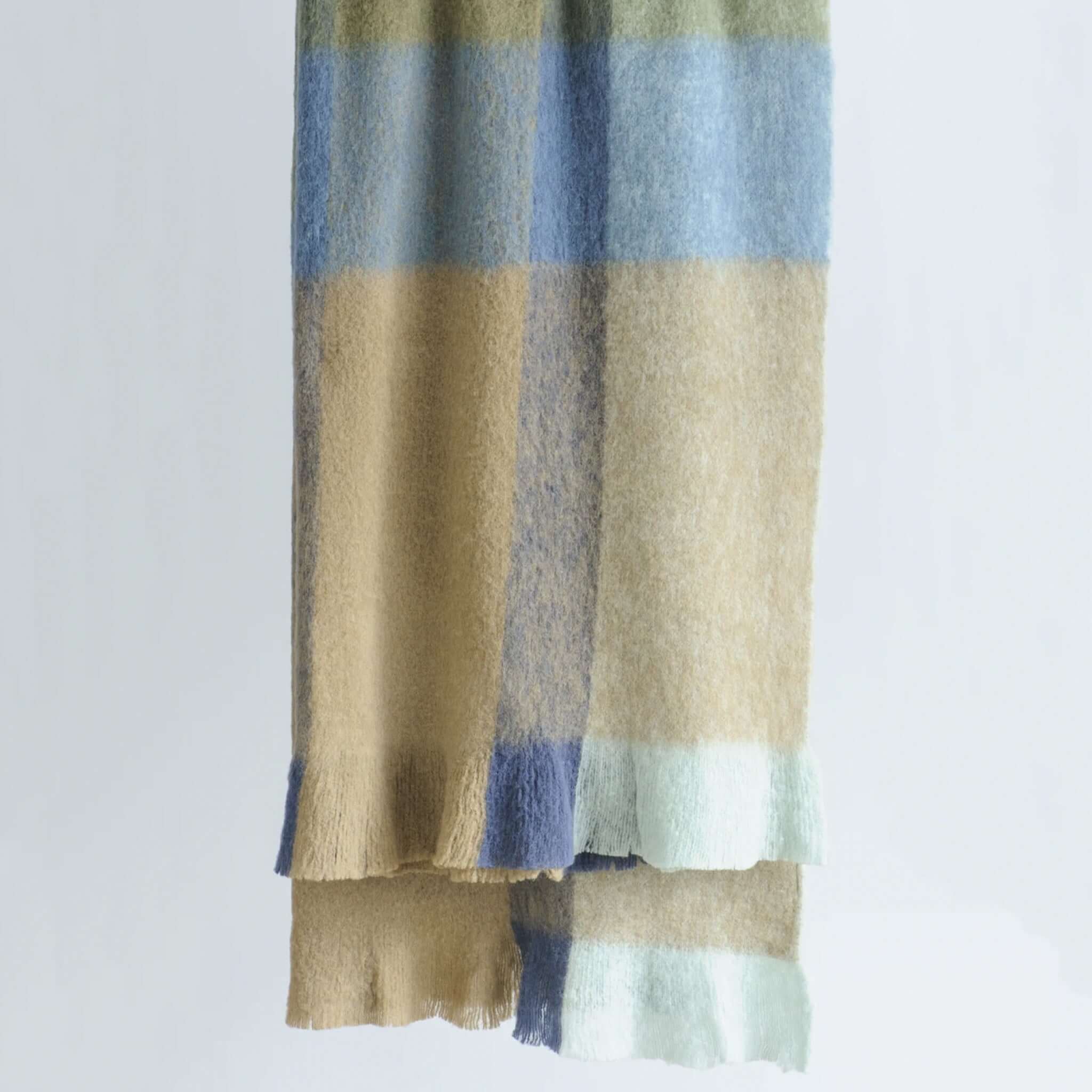 Bianca Lorenne Komichi Throw - Blue & Cedar, soft wool blanket with a bold check pattern in warm colors.