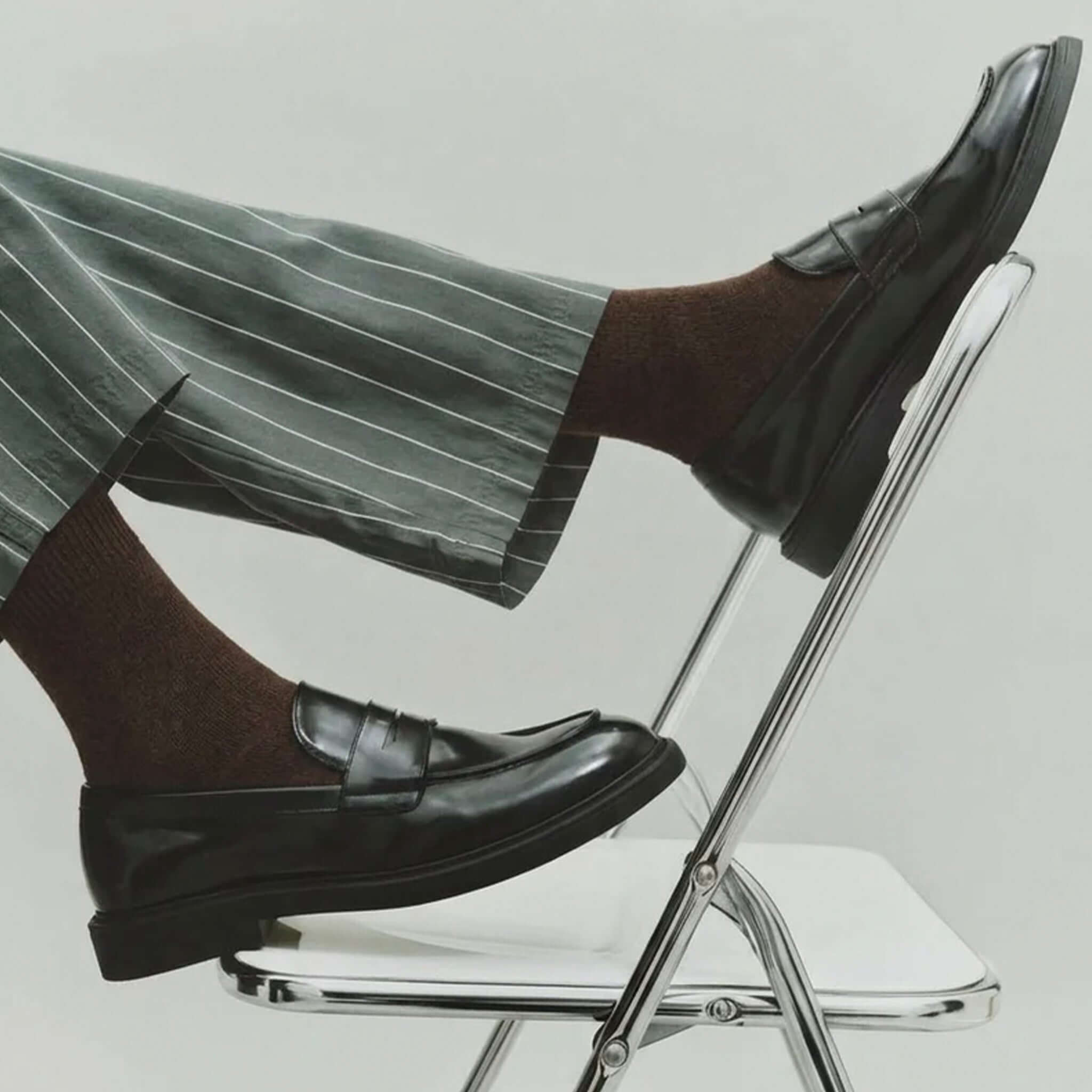 Nooan Hamilton Possum Merino Hamilton Socks - Turkish Coffee styled with sleek black shoes and gray striped pants.