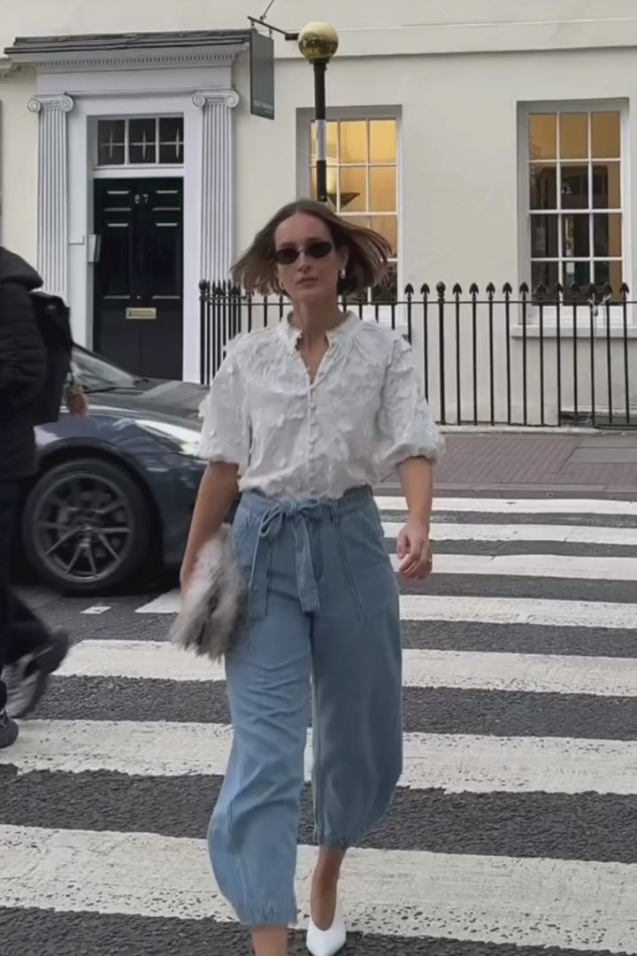 Alt Tag: Zoe Kratzmann Solstice Top - Porcelain 3D floral broderie blouse with scalloped lace trim, high neck and blouson sleeves styled in streetwear